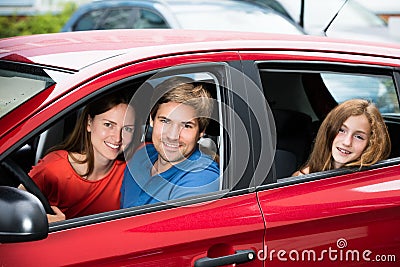 Couple Sitting In Newly Purchased Car Stock Photo