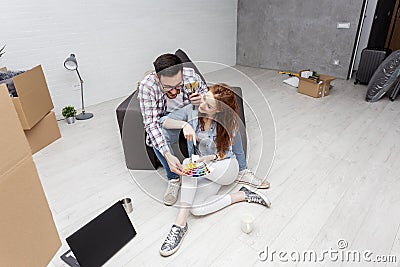 Couple sitting on sofa in flat Stock Photo