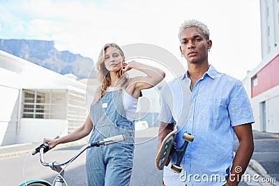 Couple, skateboard and bicycle in portrait for fashion, fun and ride in city during summer. Man, woman and bike outdoor Stock Photo