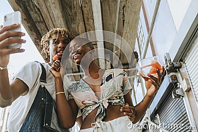 Couple snacking on fruit in the summer Stock Photo