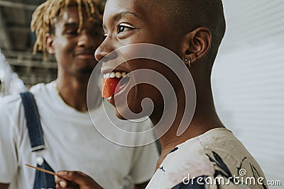 Couple snacking on fruit in the summer Stock Photo