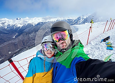 Couple snowboarders doing selfie on camera Stock Photo