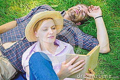 Couple soulmates at romantic date. Couple in love spend leisure reading book in park. Family enjoy leisure with poetry Stock Photo