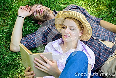Couple soulmates at romantic date. Couple in love spend leisure reading book in park. Family enjoy leisure with poetry Stock Photo