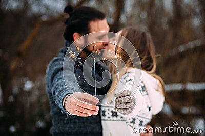 Couple with sparklers. Hipsrer couple kissing Stock Photo