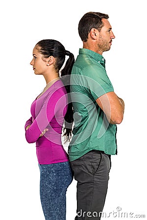 Couple standing back to back Stock Photo