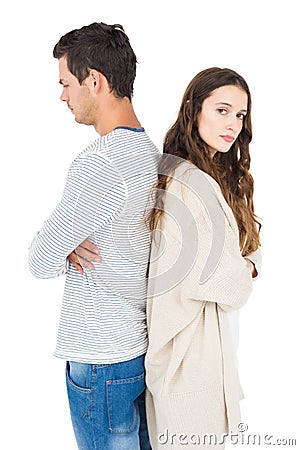 Couple standing back to back Stock Photo