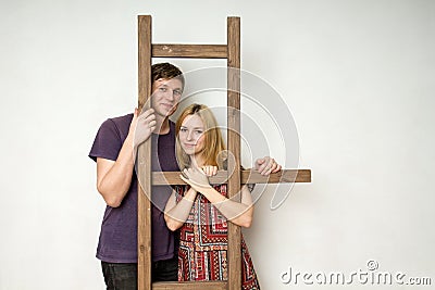 A couple is staying near the ledder Stock Photo