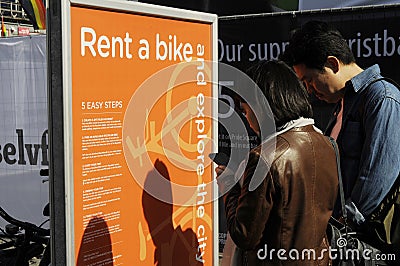 Couple studing rent bike stand Editorial Stock Photo