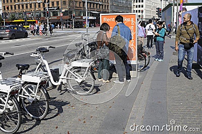 Couple studing rent bike stand Editorial Stock Photo