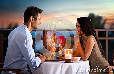 Couple on summer evening having romantic dinner Stock Photo