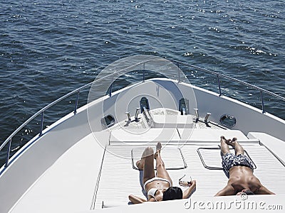https://thumbs.dreamstime.com/x/couple-sunbathing-yacht-young-luxury-33910130.jpg