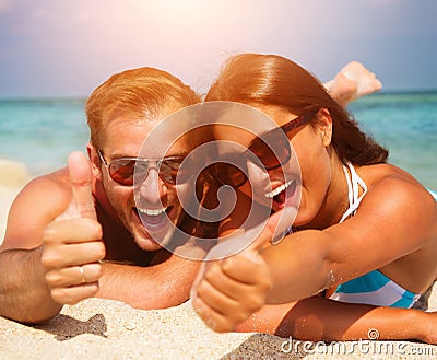 Couple in Sunglasses on the Beach Stock Photo