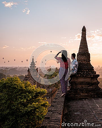 Myanmar, couple sunrise Bagan, men woman sunset Bagan .old city of Bagan Myanmar, Pagan Burma Asia old ruins Pagodas and Stock Photo