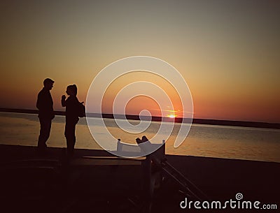 Couple and sunset Stock Photo