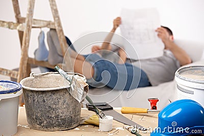 Couple taking break of painting house Stock Photo