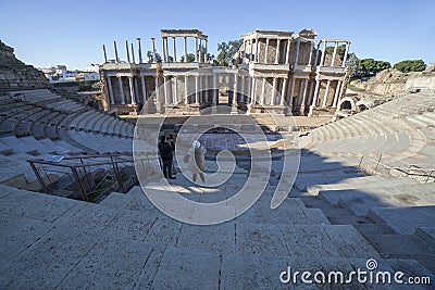 Couple taking pictures to Merida Roman theatre. Extremadura, Spain Editorial Stock Photo