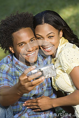 Couple taking portraits. Stock Photo