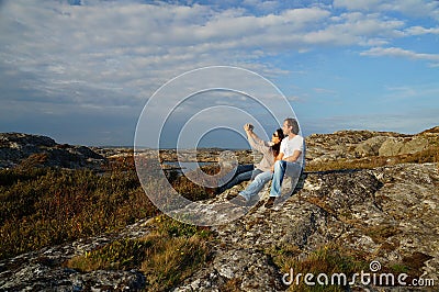 A couple is taking a selfie as a memory on the vacation Stock Photo