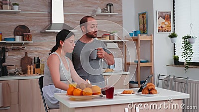 Couple talking online with family Stock Photo