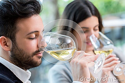 Couple tasting white wine tasting. Stock Photo