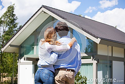 Couple and their house Stock Photo