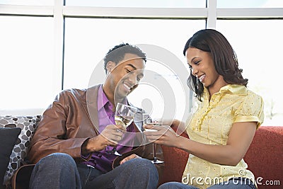 Couple toasting glasses. Stock Photo