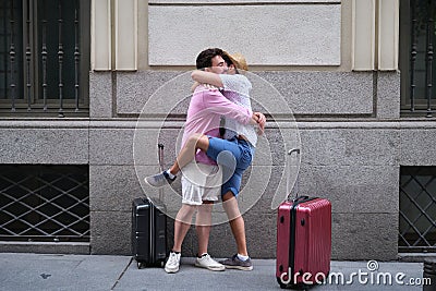 A couple of tourist hugging when then re-encounter after long time Stock Photo