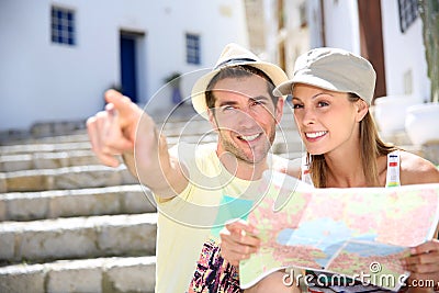 Couple of tourists enjoying in the streets of Ibiza Stock Photo