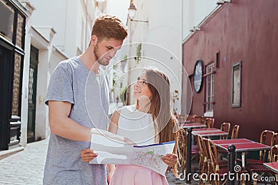 Tourists looking at the map on the street in Europe Stock Photo