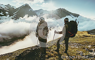 Couple travelers on mountain summit together love and Travel Lifestyle Stock Photo