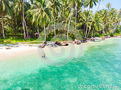 Couple on tropical beach at Tailana Banyak Islands Sumatra tropical archipelago Indonesia, Aceh, coral reef white sand beach Stock Photo