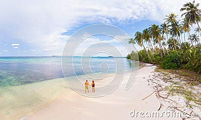 Couple on tropical beach at Tailana Banyak Islands Sumatra tropical archipelago Indonesia, Aceh, coral reef white sand beach Stock Photo