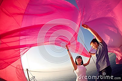 Couple under the sail Stock Photo