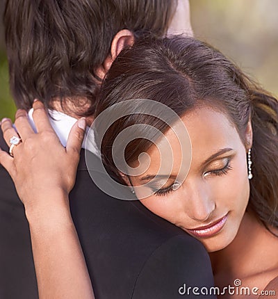Couple, unity and embrace on wedding day for love, support and together for marriage and commitment. People, romance and Stock Photo