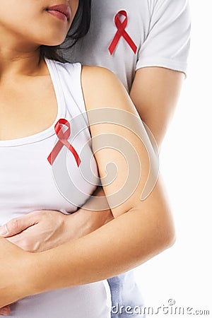 Couple using badge to support AIDS Stock Photo