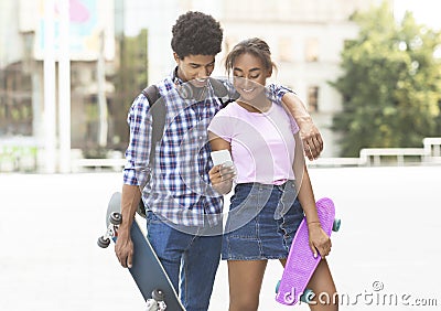 Couple using gps navigator in smartphone trying find famous cafe Stock Photo