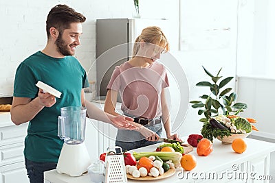 couple of vegans cooking food Stock Photo