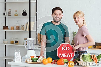 couple of vegans holding no meat sign Stock Photo