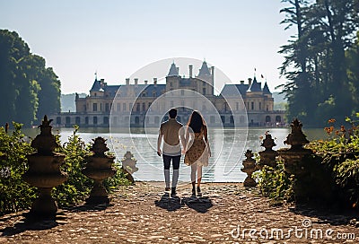 A couple at the Versailles castle in France Stock Photo