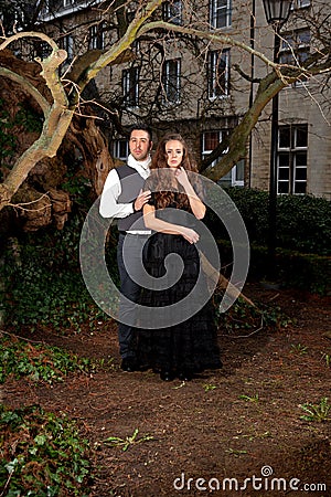 Couple Victorian clothing in the park Stock Photo