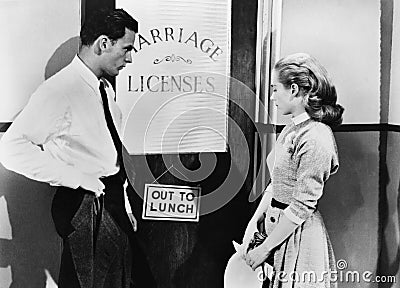 Couple waiting outside marriage license office Stock Photo