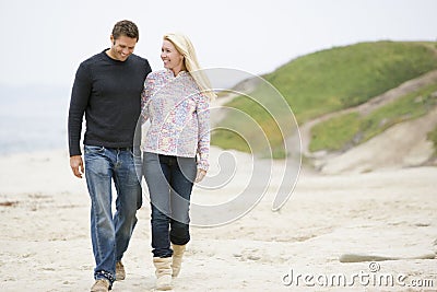 Couple walking at beach Stock Photo