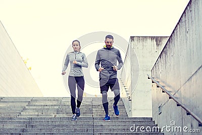 Couple walking downstairs on stadium Stock Photo