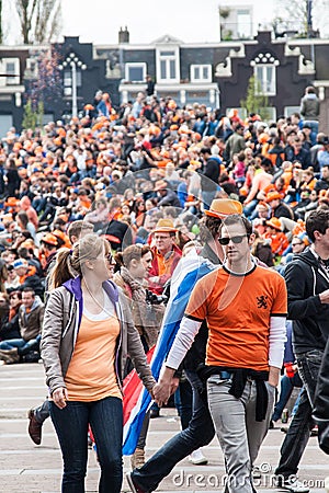 Couple walking at Koninginnedag 2013 Editorial Stock Photo