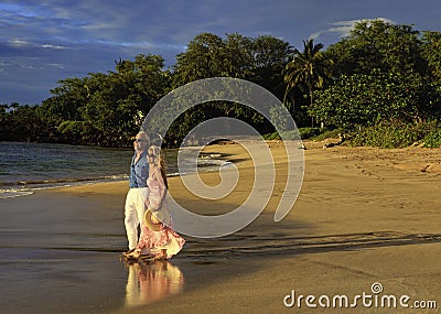 Couple walking on a maui beach Stock Photo