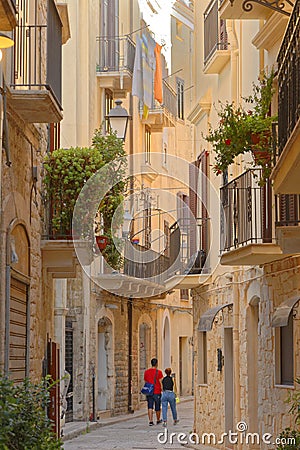 A couple walking through the Old Town of Bari, Italy. Outdoor, italia. Editorial Stock Photo