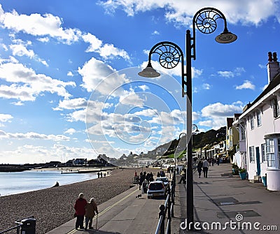 Couple walking on promenade in sea town . Editorial Stock Photo