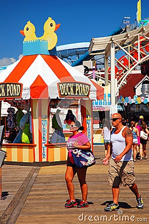 Rides and carnival games on the Boardwalk Editorial Stock Photo