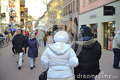 A couple walks in the streets of Colmar France. Editorial Stock Photo
